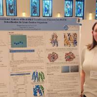 Morgan Buchman presenting her poster at the Midwest Enzyme Chemistry Conference (2022)